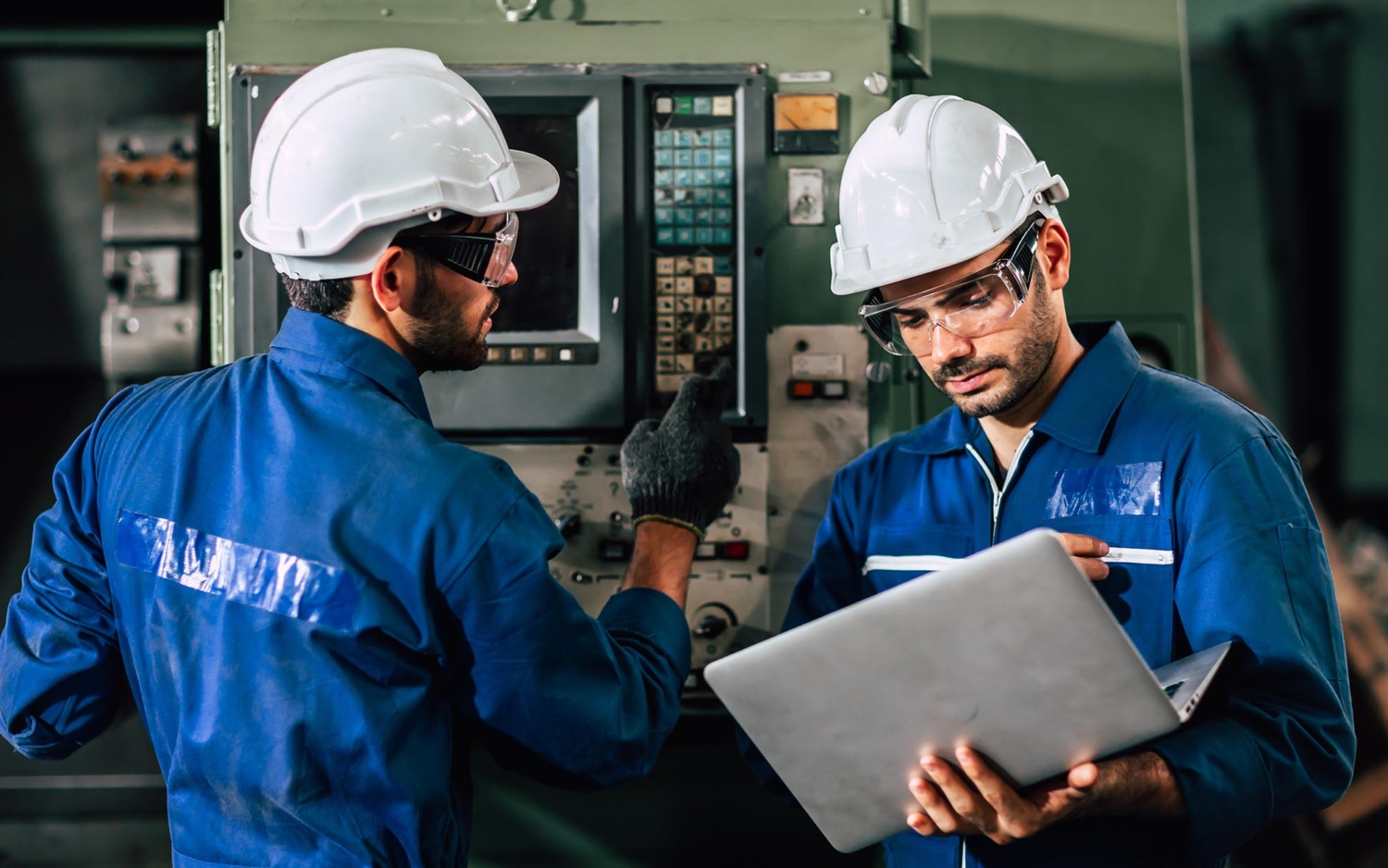 MEP Engineers working on HVAC programming equipment